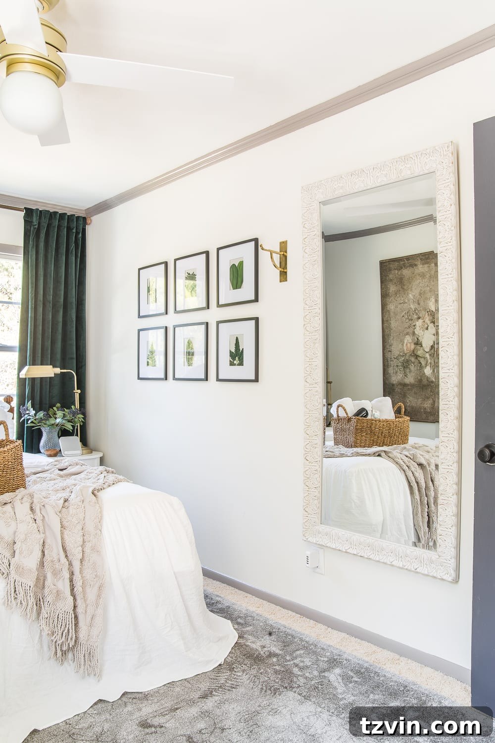 A full-length mirror and a wall hook in a guest bedroom, emphasizing practical amenities for dressing and organization.