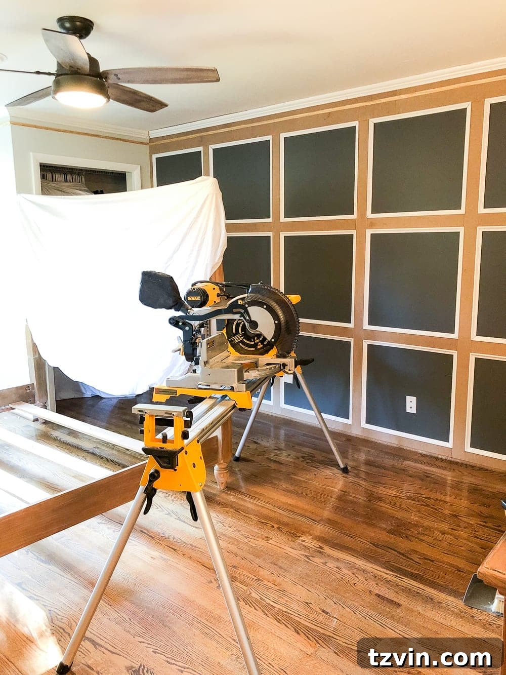 Completed traditional grid molding focal wall in a master bedroom