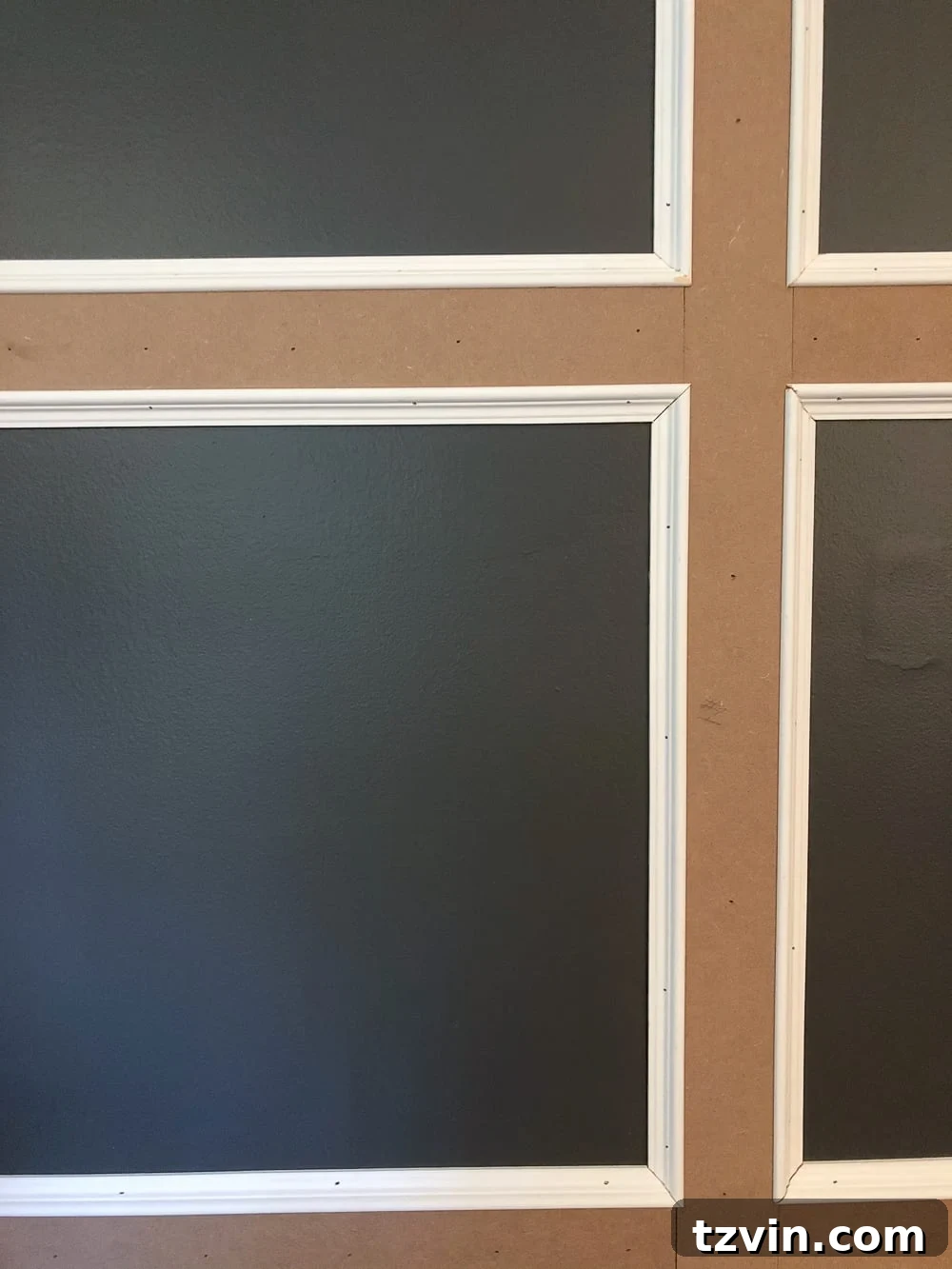 Applying decorative finger-joint molding to the grid panels