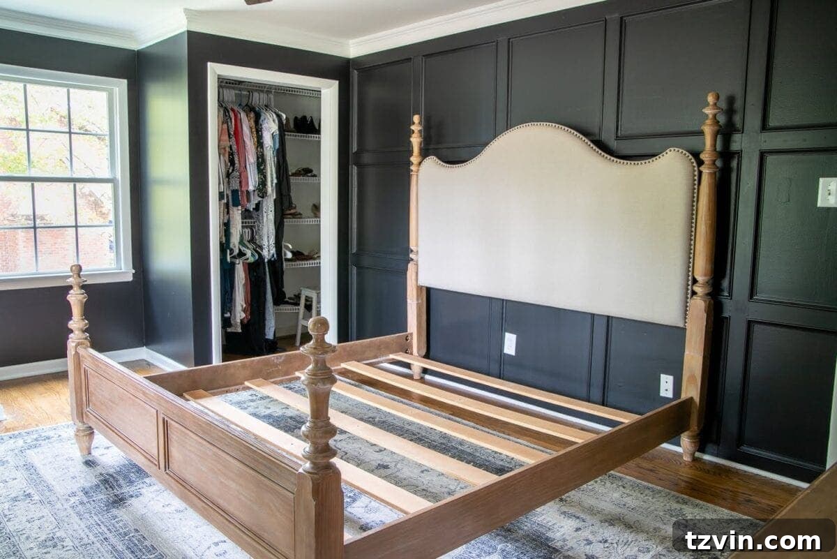 Master Bedroom Transformation: 5 Hard-Earned Painting Insights 14 The master bedroom with black walls and a glimpse of furniture, indicating progress in the room's decor.