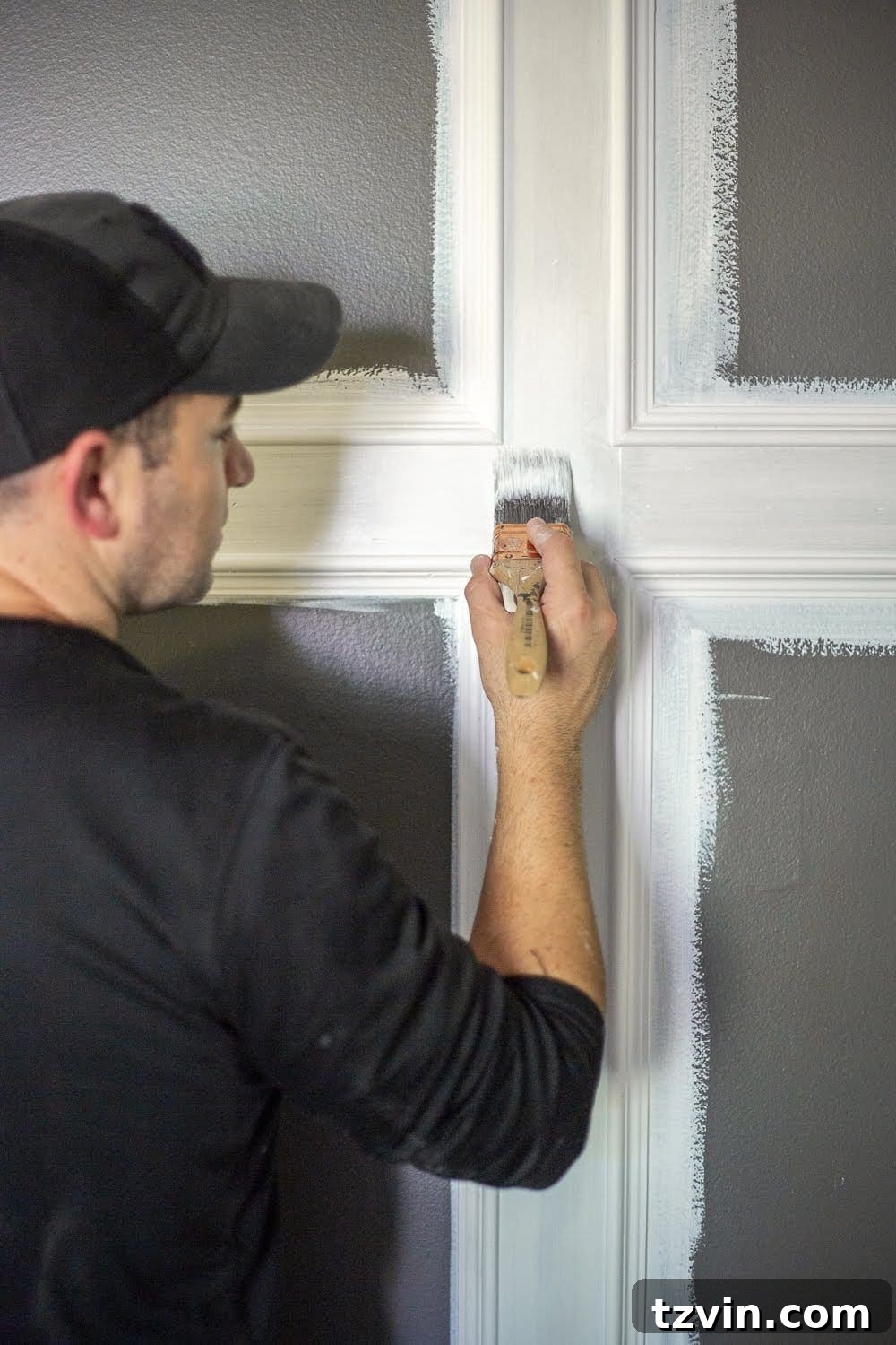 Master Bedroom Transformation: 5 Hard-Earned Painting Insights 5 Close-up of a wall being prepped with KILZ 2 All-Purpose primer, highlighting the detailed work involved in achieving a smooth base.