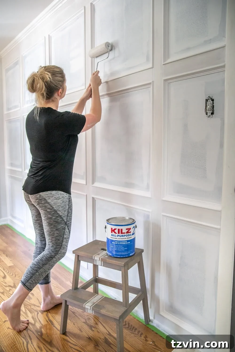 Master Bedroom Transformation: 5 Hard-Earned Painting Insights 6 Applying KILZ 2 All-Purpose primer to the newly installed grid molding on a focal wall, ensuring a smooth, even base for paint.