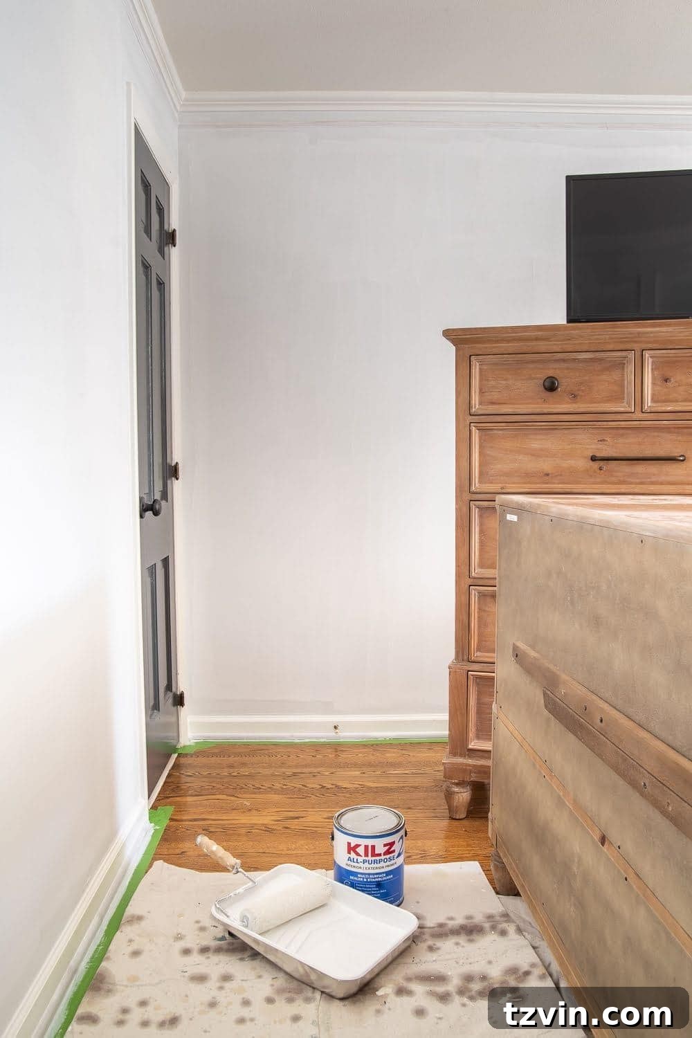 Master Bedroom Transformation: 5 Hard-Earned Painting Insights 9 The process of painting a wall in the master bedroom, emphasizing preparation steps.