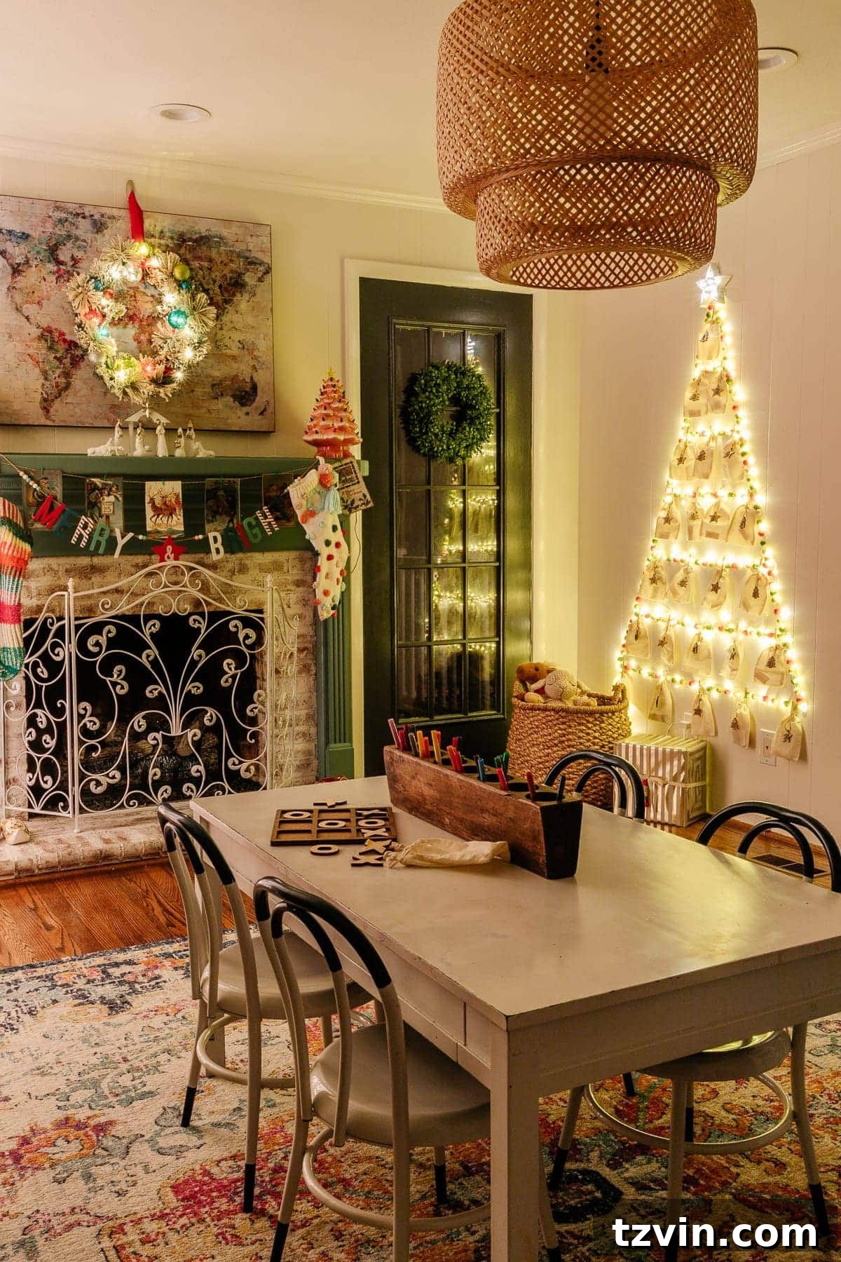 A cheap DIY wall Christmas tree with lights and Advent calendar bags, illuminating a cozy playroom scene at night.