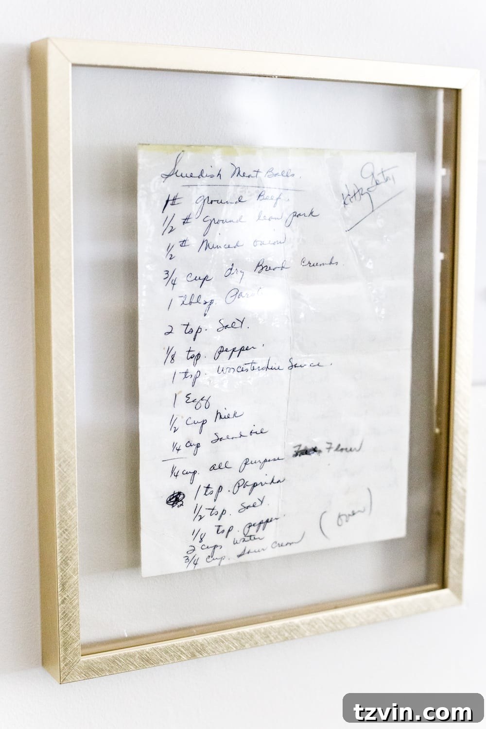 Swedish Christmas Charm: Blending Sentimental Decor with Modern Touches 8 A framed handwritten recipe displayed in a kitchen, offering a sentimental and personalized wall decor element.