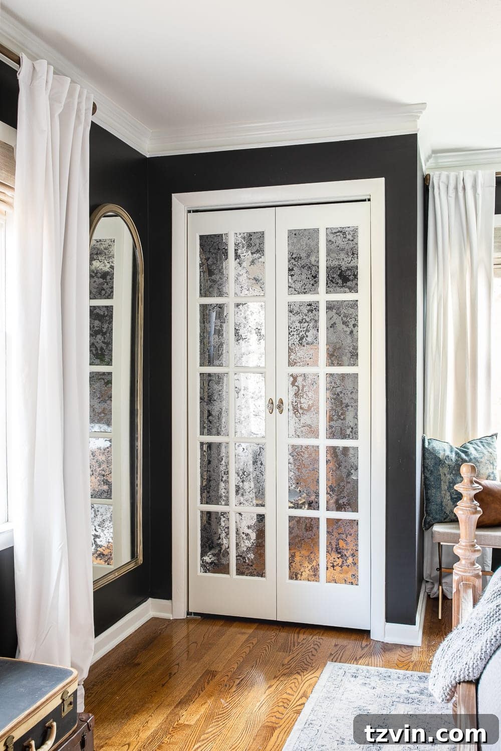 Effortless Mirrored French Bi-Fold Closet Door Upgrade 13 Mirrored French Closet Doors – close-up of French antique-inspired bifold closet doors in a bedroom