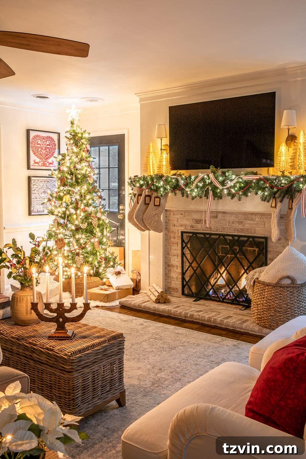 Enchanted Holiday Evenings 2019 16 Christmas living room at night with fireplace and tree, creating a warm and festive atmosphere