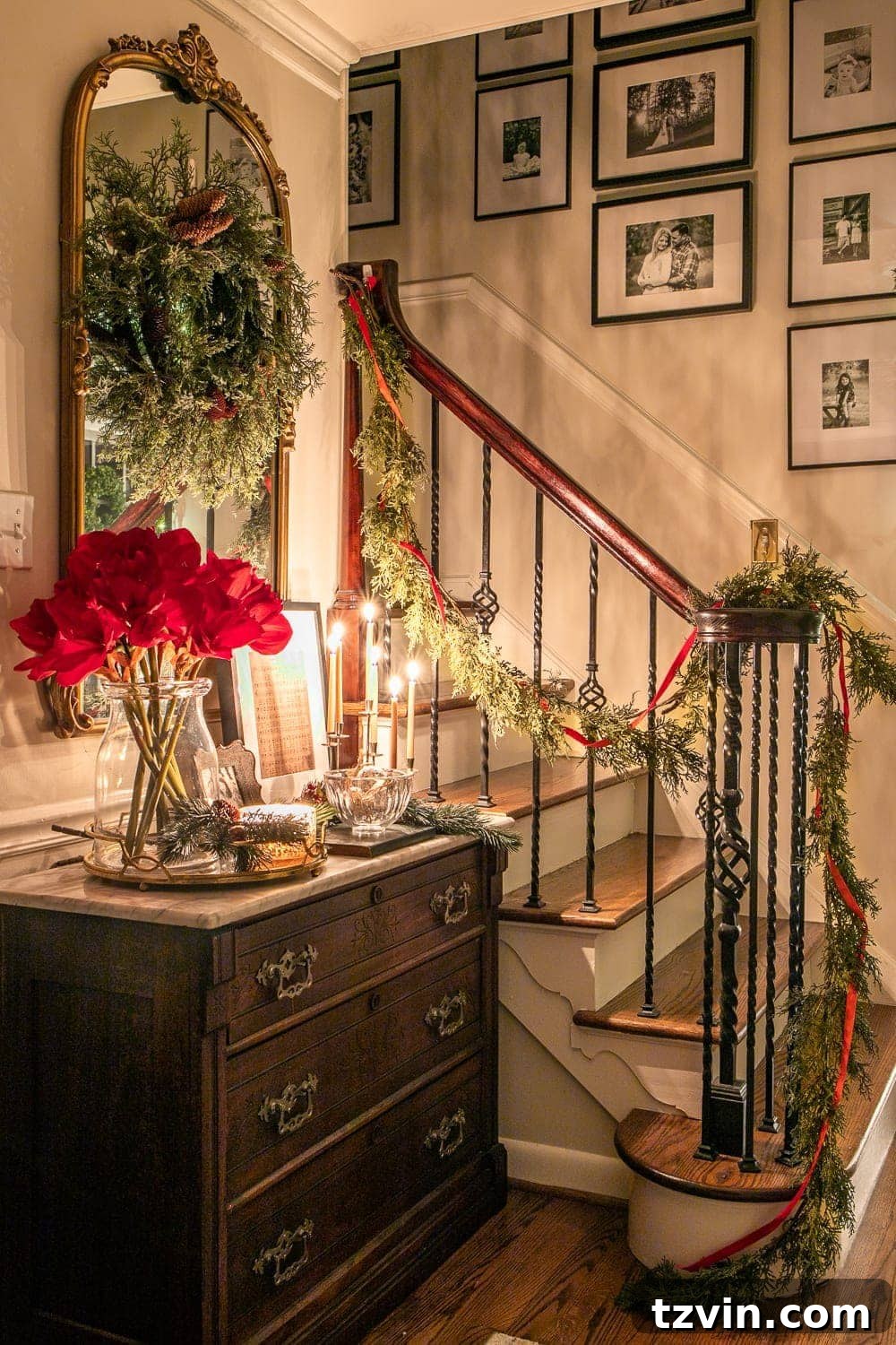 Enchanted Holiday Evenings 2019 4 Christmas foyer and staircase at night, adorned with festive garland and lights