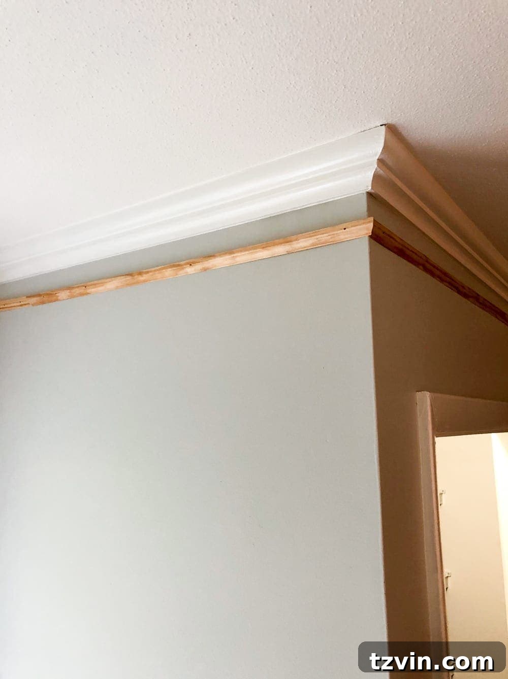 Boosting Crown Molding and Baseboard Presence 3 Close-up of Beefed Up Crown Molding and Baseboard - Before and After