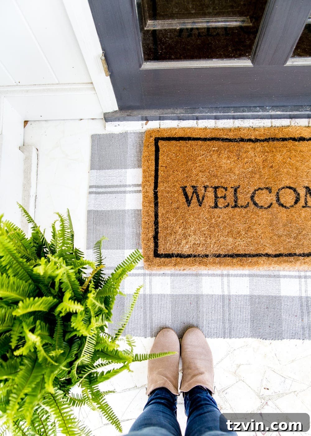 My 2019 Essentials 19 Gray and white check rug on a porch with spring decor