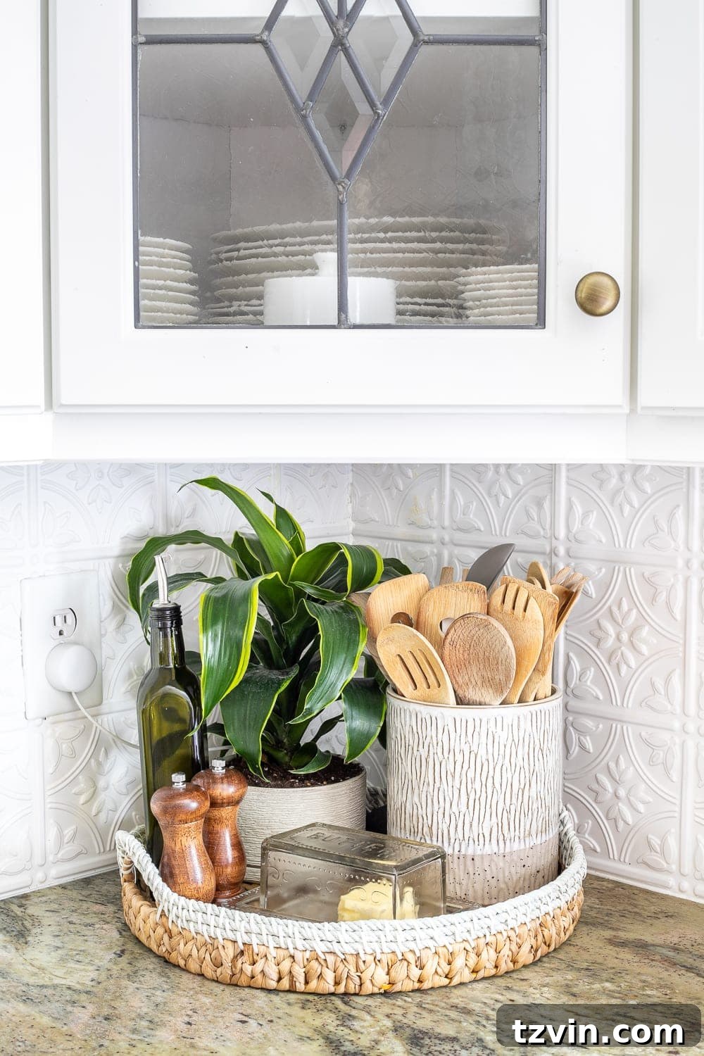 Stylish Countertops Made Simple 7 Kitchen countertop decor featuring a tray with cooking utensils, a plant, olive oil, butter dish, and salt and pepper grinders