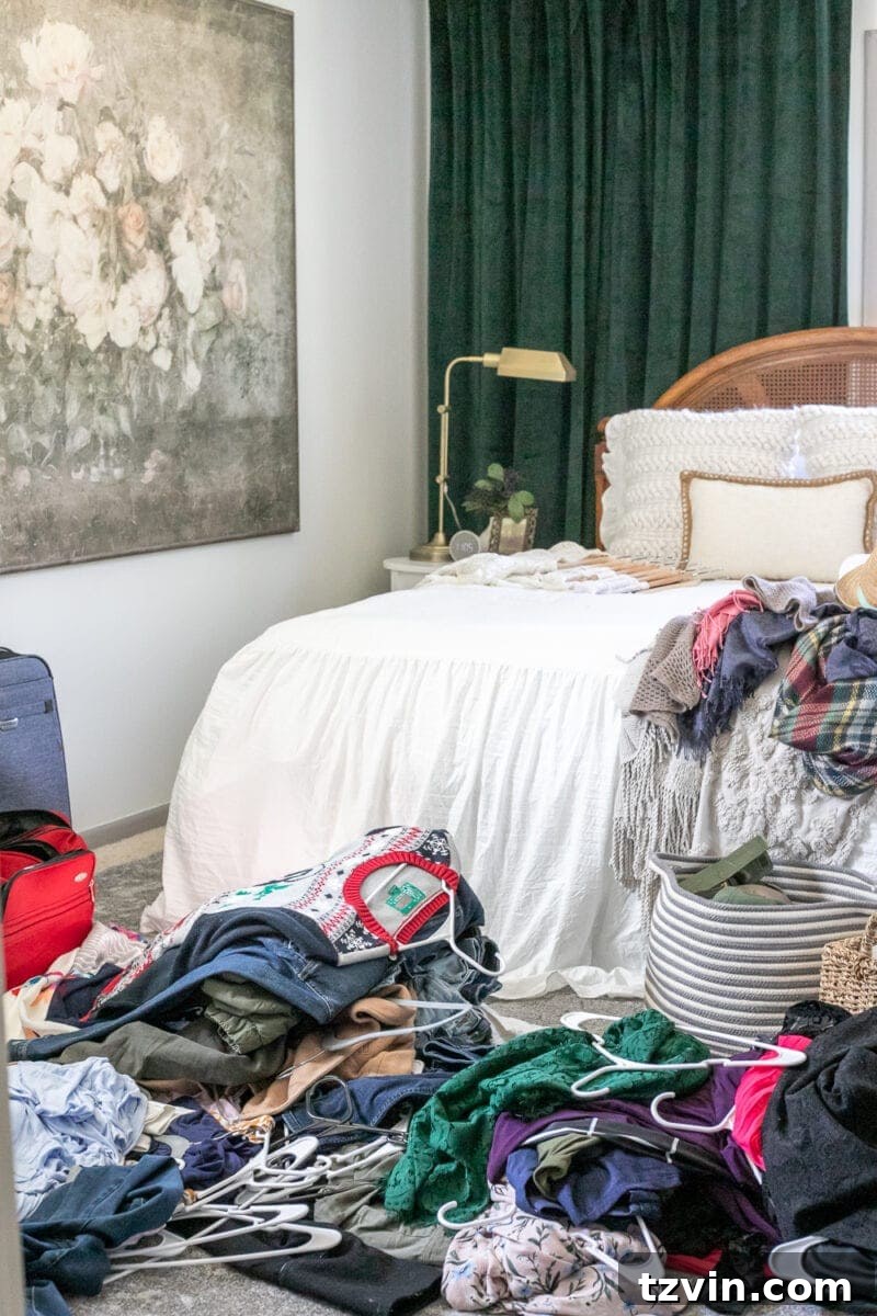 Declutter Your Closet: The Essential Roadmap 7 A messy bedroom floor during a closet cleanout process, showing the reality of decluttering.