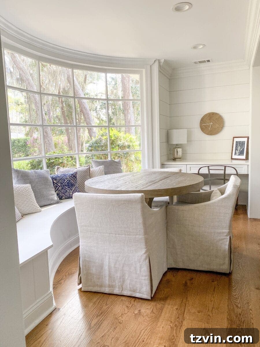 Coastal Elegance Sea Island Home Showcase 9 Sea Island Coastal House Tour | coastal breakfast nook with window banquette and writing desk