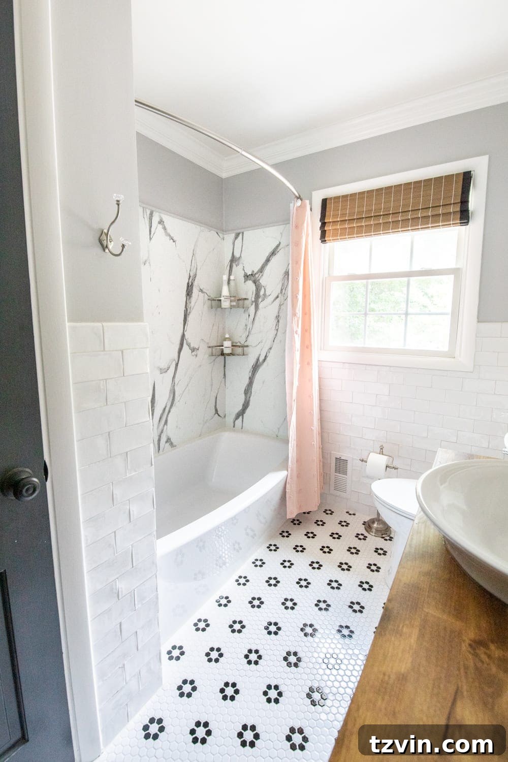 girls bathroom with pink shower curtain