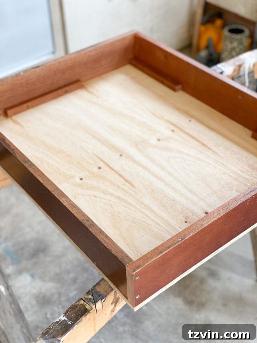 The assembled wooden planter box with plywood backing, ready for finishing