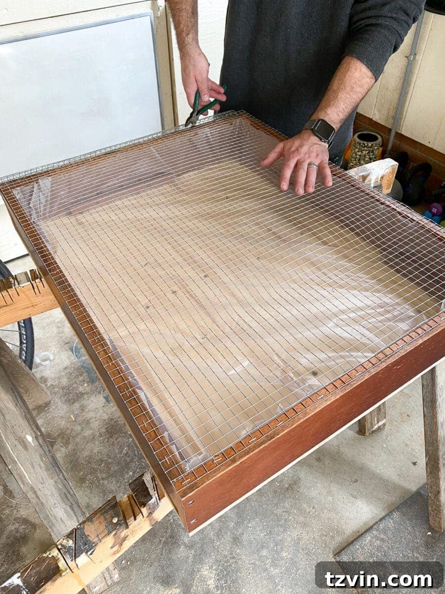 Trimming and flattening the edges of the hardware cloth for safety