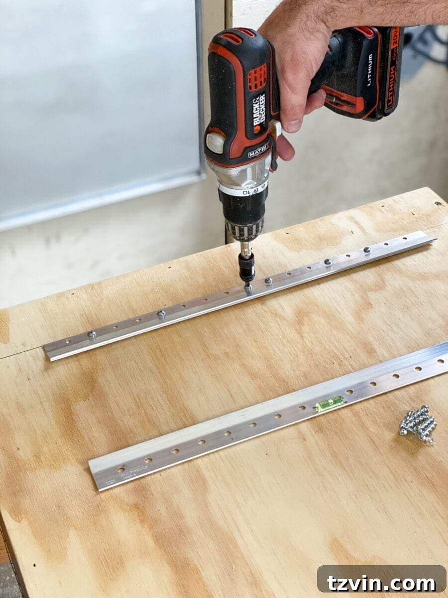 Attaching the Hangman hanger to the back of the plywood planter