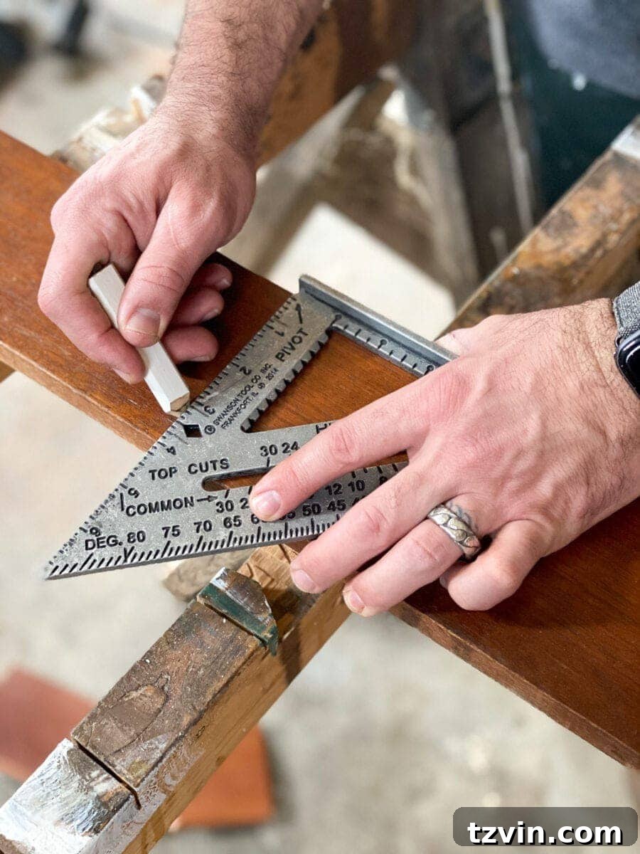Marking wood boards with a measuring tape and pencil for the DIY wall planter