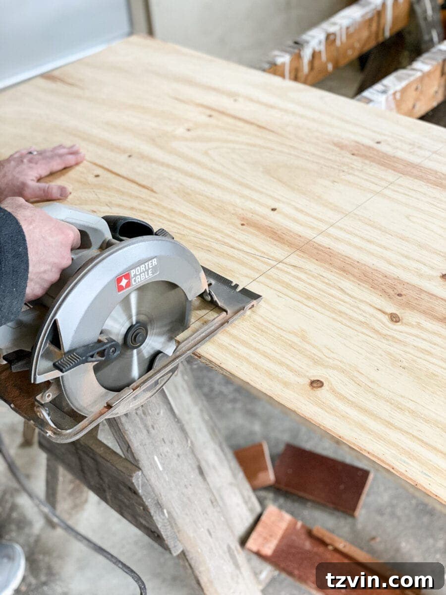 Detailed shot of cutting plywood for the back panel of the vertical planter