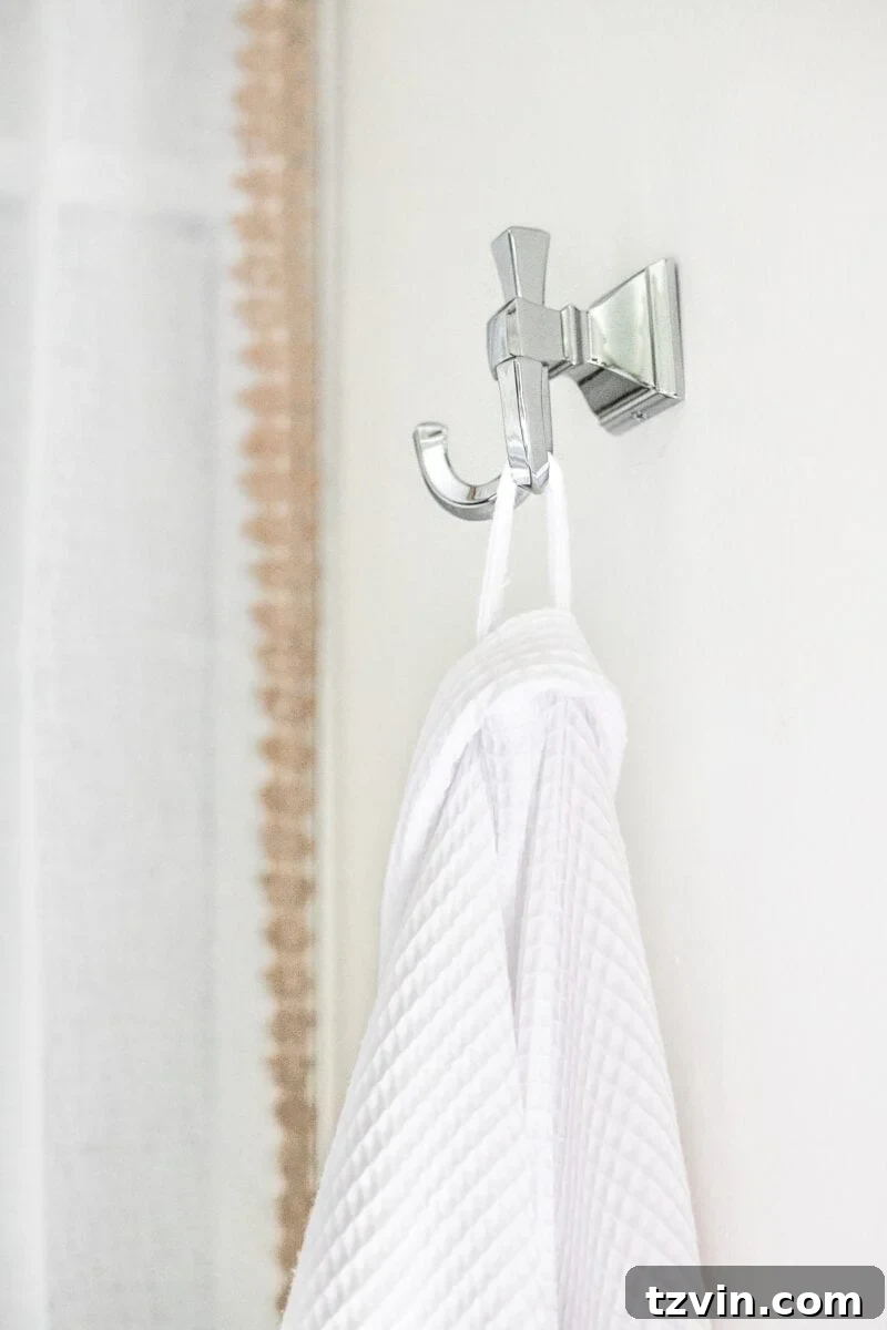 Next Level Master Bathroom 11 Master Bathroom Refresh | A dated master bathroom gets a quick and inexpensive modern refresh using paint, wallpaper, sheet vinyl, and hardware.