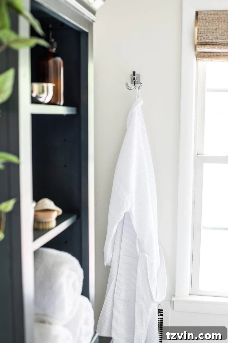Next Level Master Bathroom 12 Master Bathroom Refresh | A dated master bathroom gets a quick and inexpensive modern refresh using paint, wallpaper, sheet vinyl, and hardware.