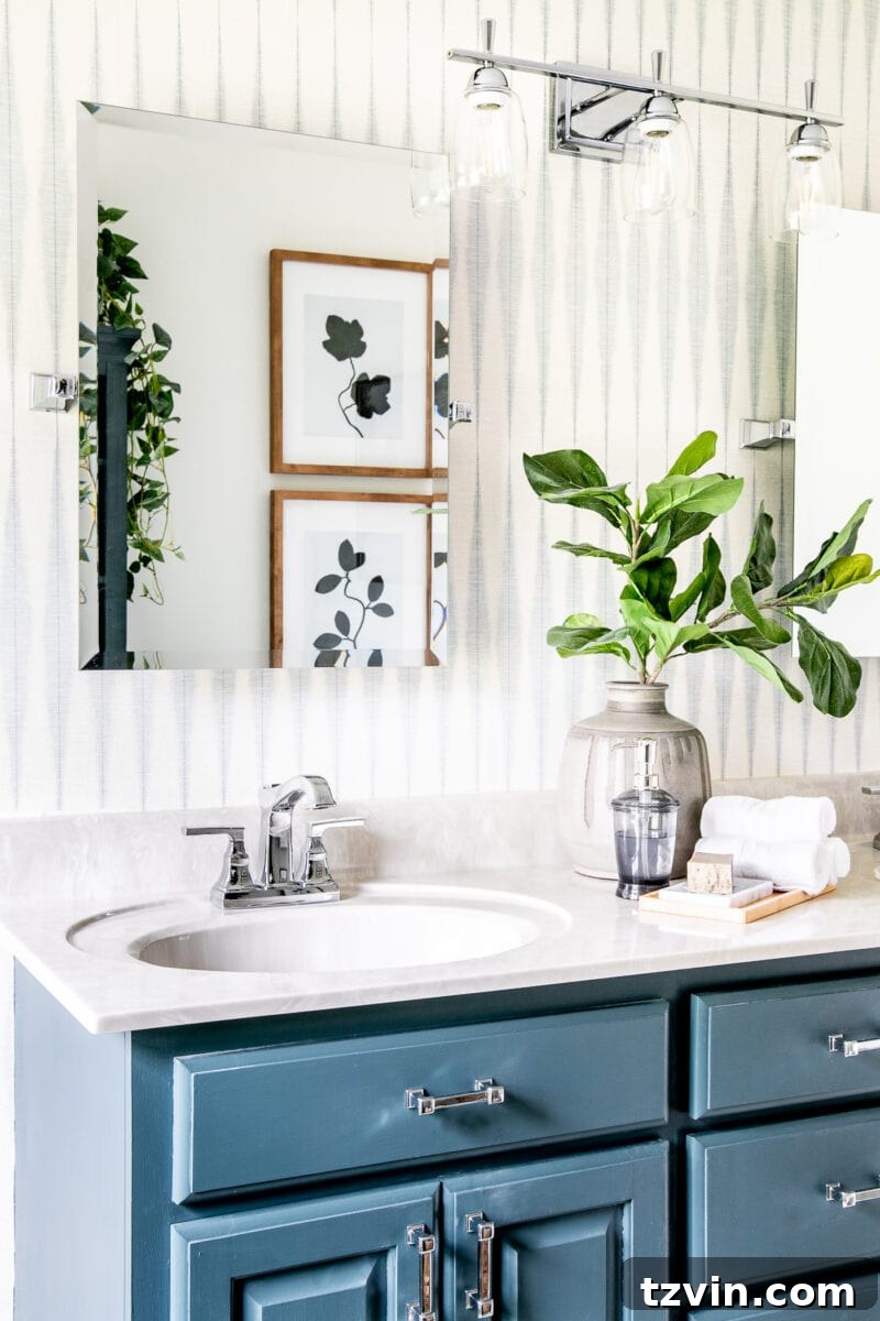 Next Level Master Bathroom 13 Master Bathroom Refresh | A dated master bathroom gets a quick and inexpensive modern refresh using paint, wallpaper, sheet vinyl, and hardware.