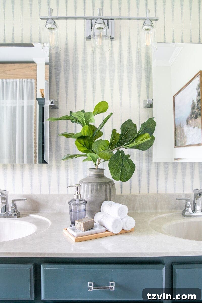 Next Level Master Bathroom 14 Master Bathroom Refresh | A dated master bathroom gets a quick and inexpensive modern refresh using paint, wallpaper, sheet vinyl, and hardware.