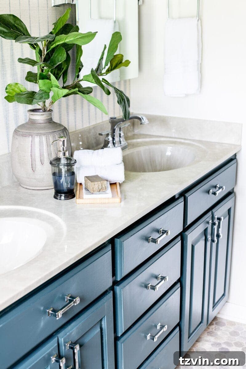 Next Level Master Bathroom 15 Master Bathroom Refresh | A dated master bathroom gets a quick and inexpensive modern refresh using paint, wallpaper, sheet vinyl, and hardware.
