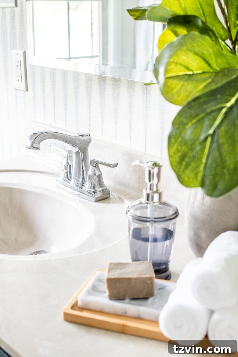 Next Level Master Bathroom 16 Master Bathroom Refresh | A dated master bathroom gets a quick and inexpensive modern refresh using paint, wallpaper, sheet vinyl, and hardware.