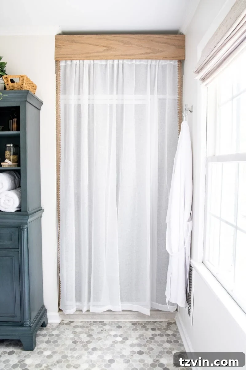 Next Level Master Bathroom 10 Master Bathroom Refresh | A dated master bathroom gets a quick and inexpensive modern refresh using paint, wallpaper, sheet vinyl, and hardware.