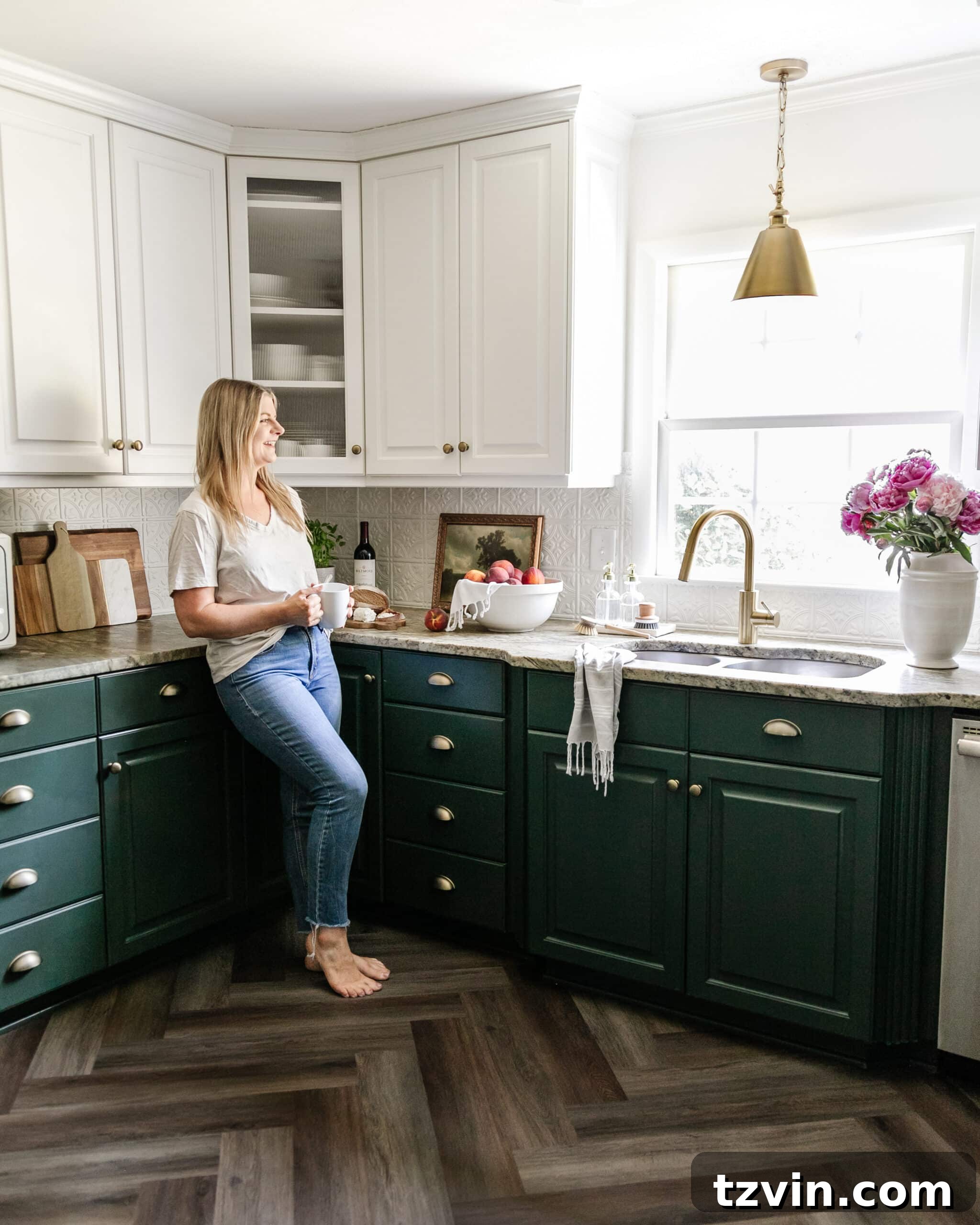 Kitchen cabinets painted Sherwin Williams Billiard Green and Benjamin Moore Simply White, showcasing a harmonious color palette inspired by existing elements.