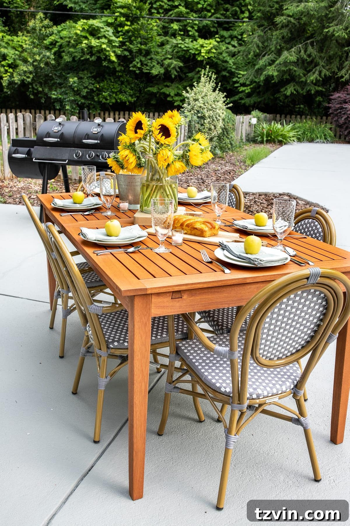 Summer Patio Refresh and Al Fresco Dining Oasis 5 Close-up of comfortable and stylish French bistro armchairs with patterned details on a patio.