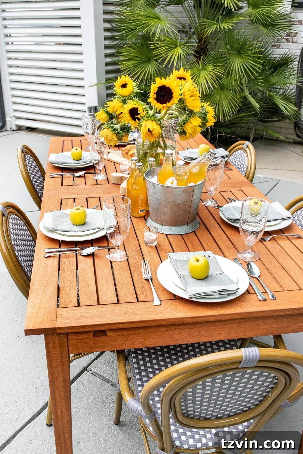 Summer Patio Refresh and Al Fresco Dining Oasis 6 Beautifully styled outdoor dining tablescape with food, drinks, and decor set for a summer gathering.