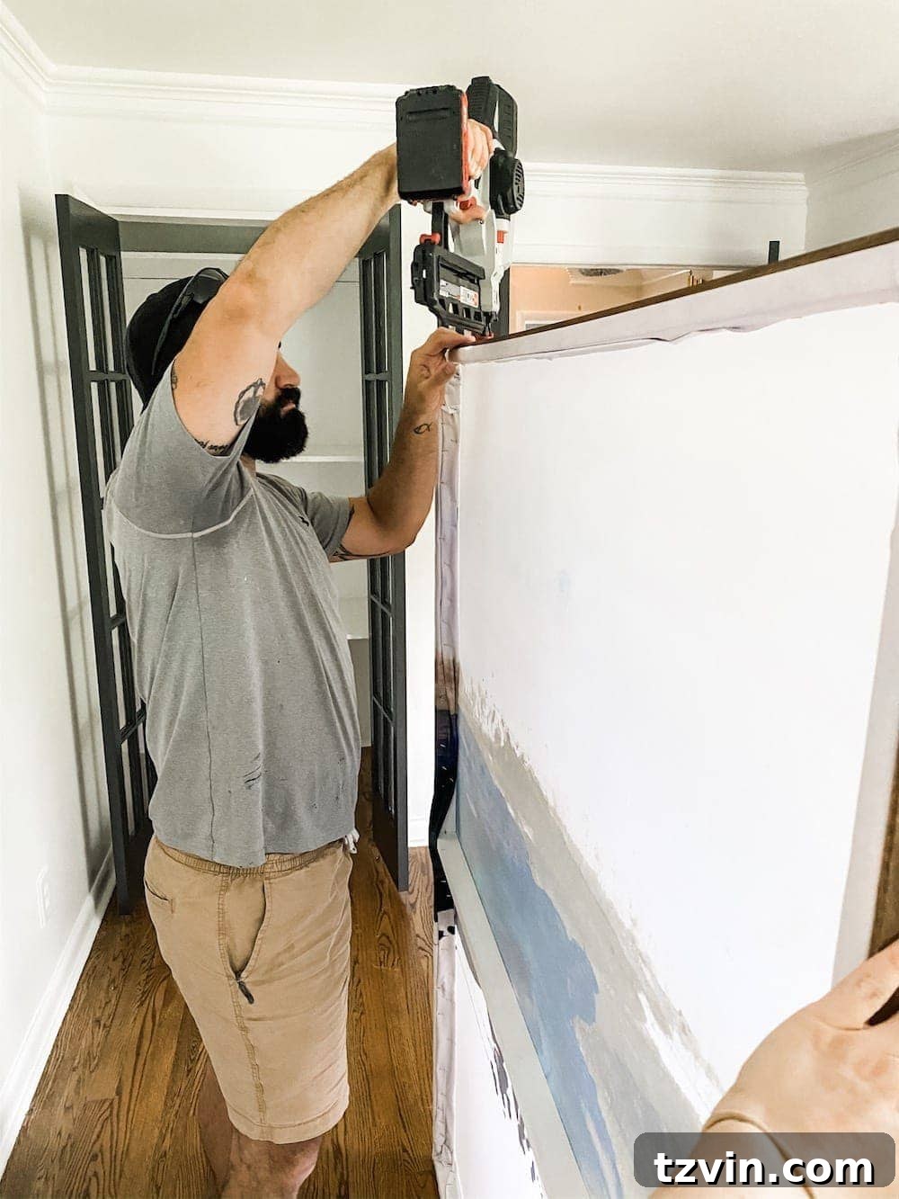 DIY Statement Piece: Oversized Wall Art from a Shower Curtain 12 Attaching top lattice strip to DIY large wall art