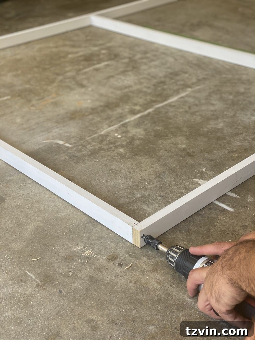 DIY Statement Piece: Oversized Wall Art from a Shower Curtain 6 Attaching boards with screws for canvas frame