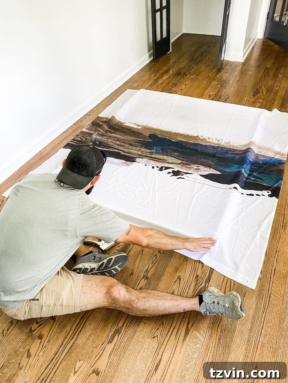 DIY Statement Piece: Oversized Wall Art from a Shower Curtain 8 Aligning shower curtain on canvas frame