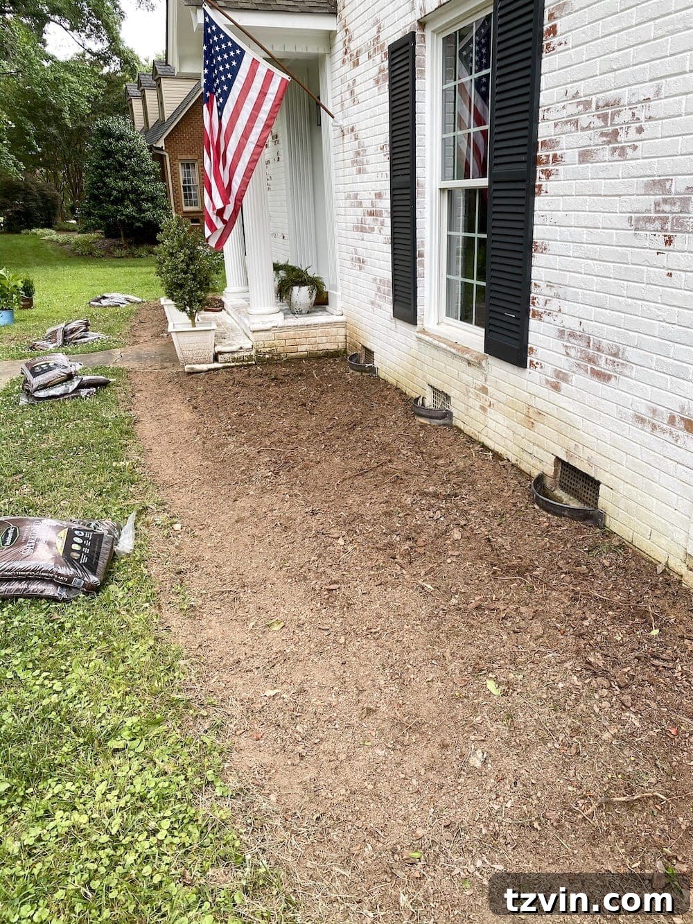 DIY Front Yard Flower Bed Glow Up 11 STIHL Yard Boss with cultivator attachment tilling soil in a garden bed