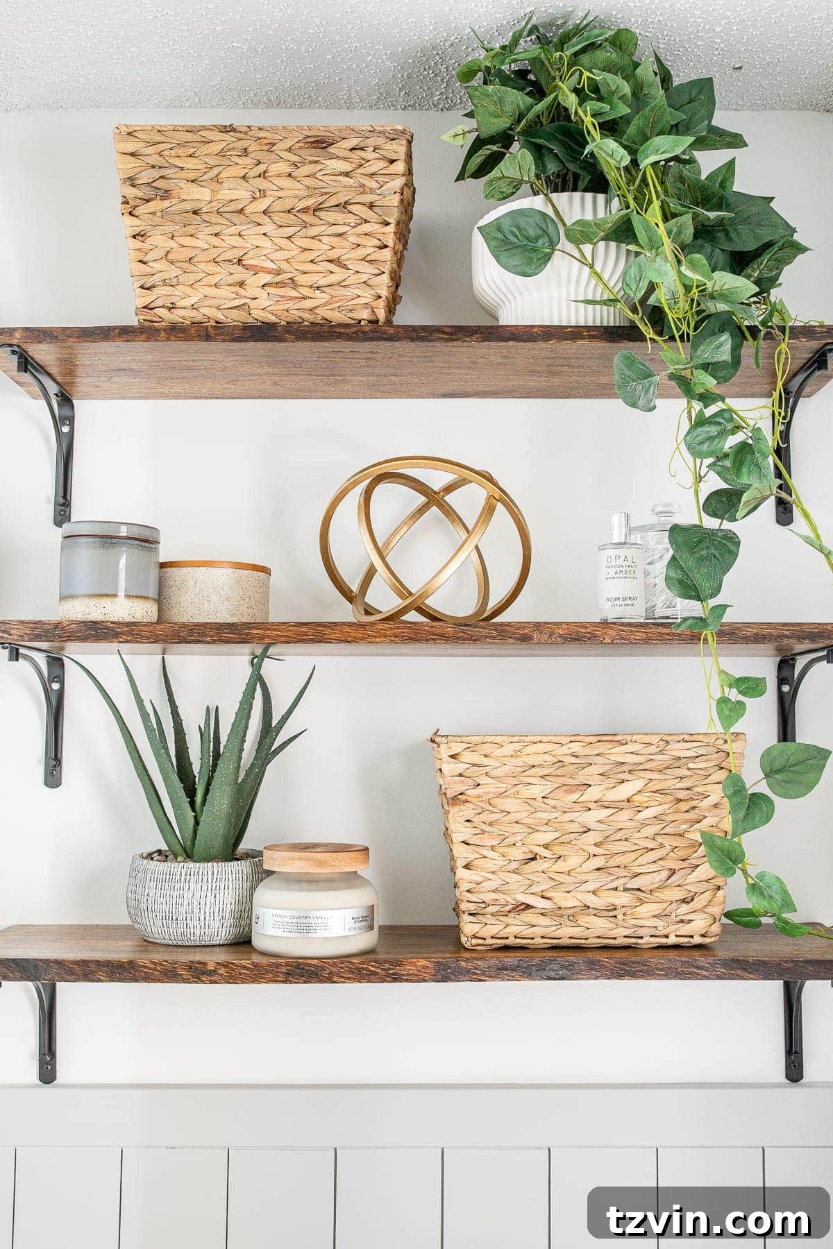 Detailed view of bathroom shelves with baskets, small storage, various plants, and decorative elements