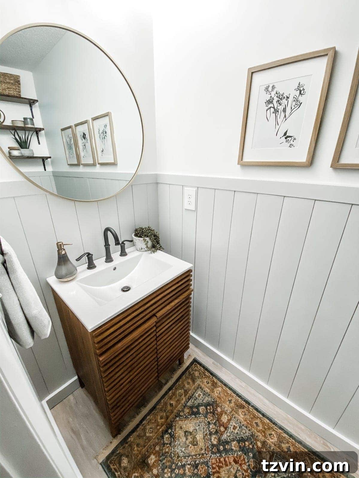 Powder room showcasing gray vertical shiplap and clean white walls for a California Casual feel