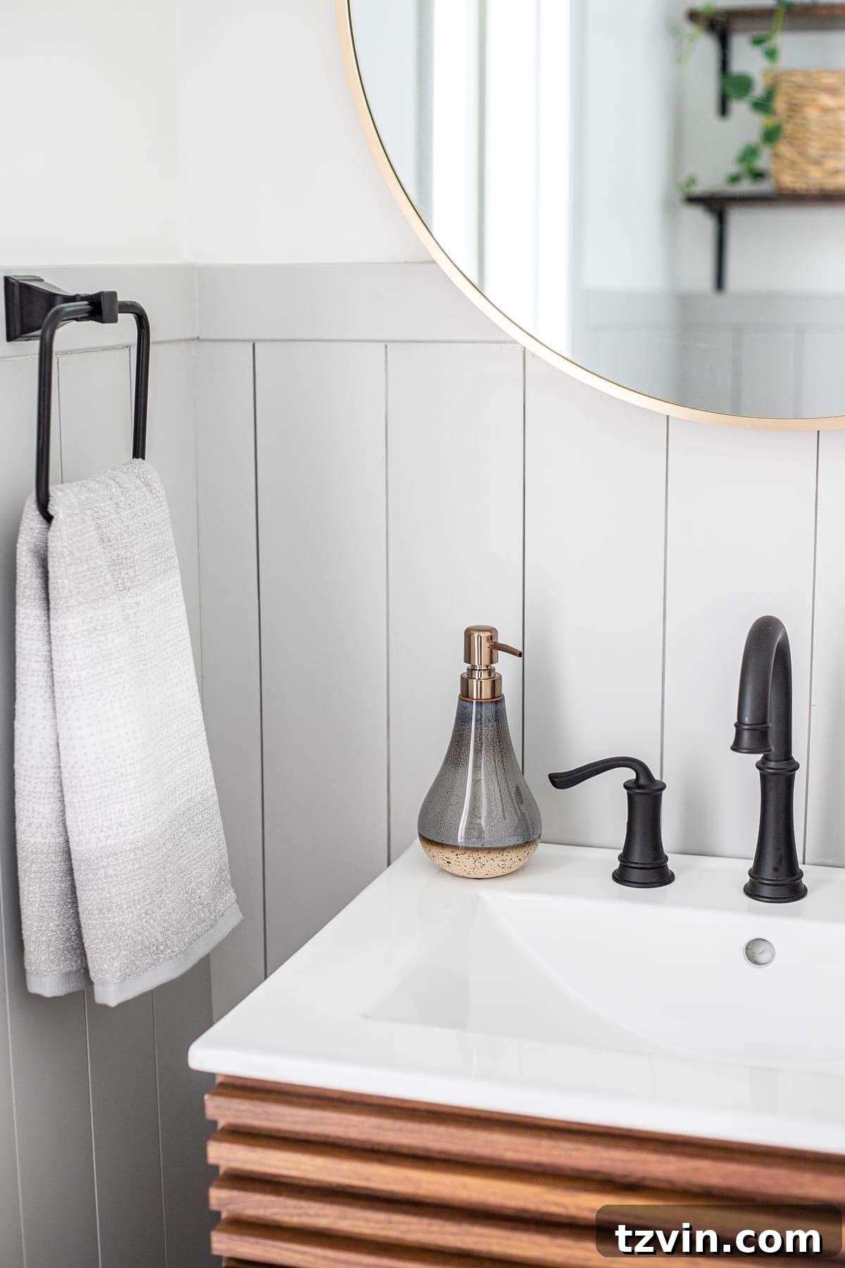 Powder room decor and vertical gray shiplap details