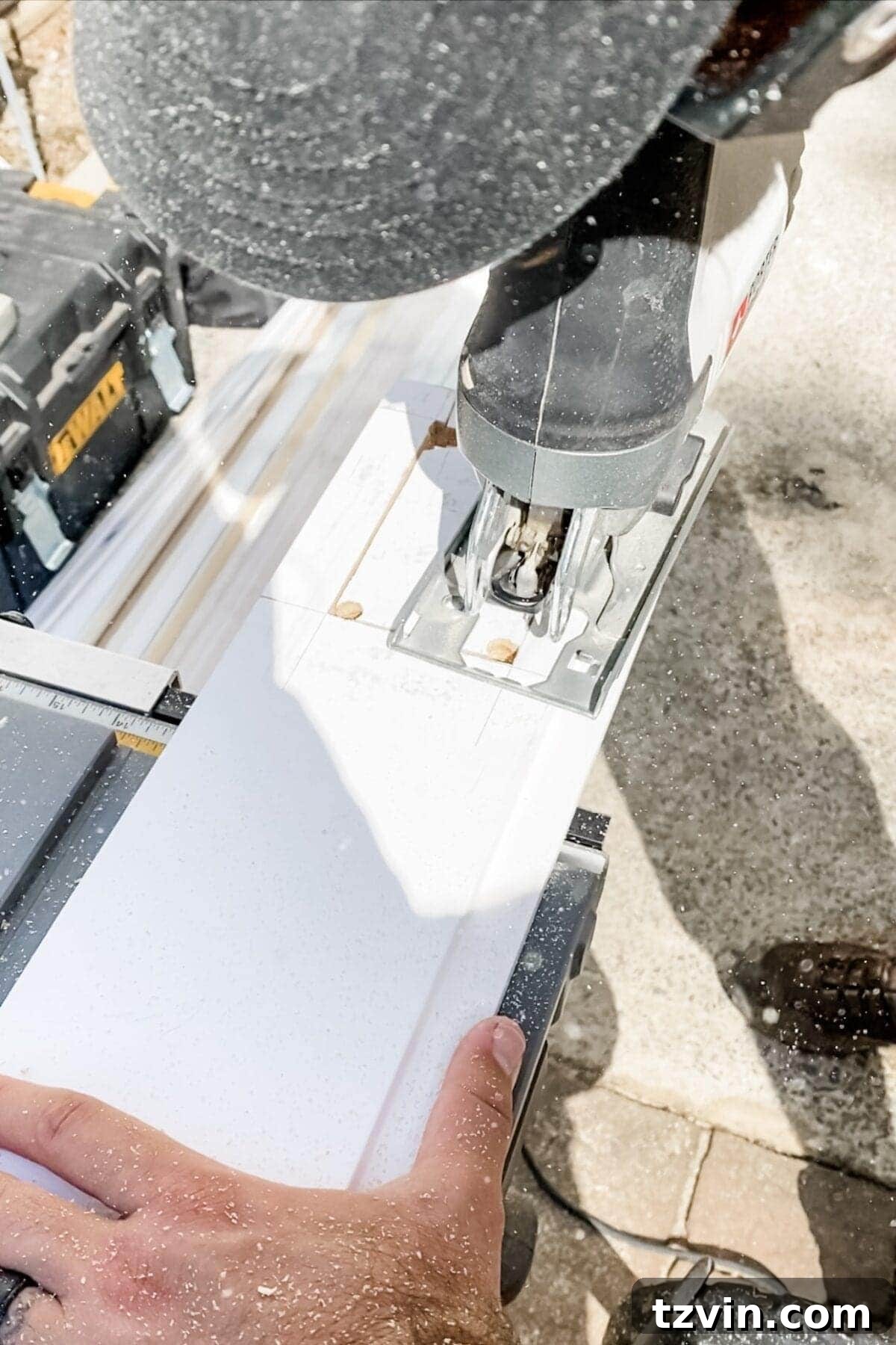 A jigsaw in action, cutting along the lines of a traced outlet hole in a shiplap board, demonstrating the technique for creating precise openings.
