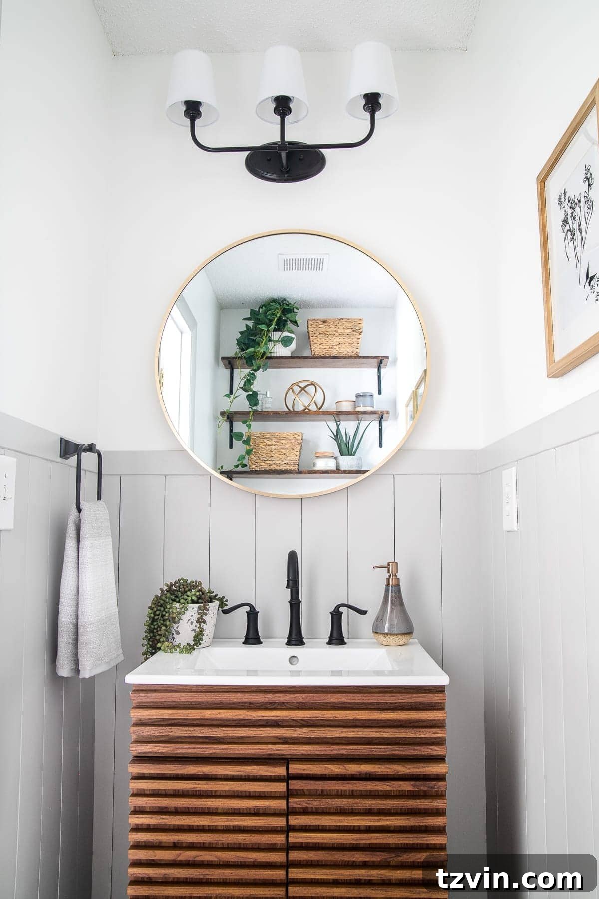 A complete California Casual powder room makeover featuring elegant vertical shiplap, modern fixtures, and thoughtful decor elements.
