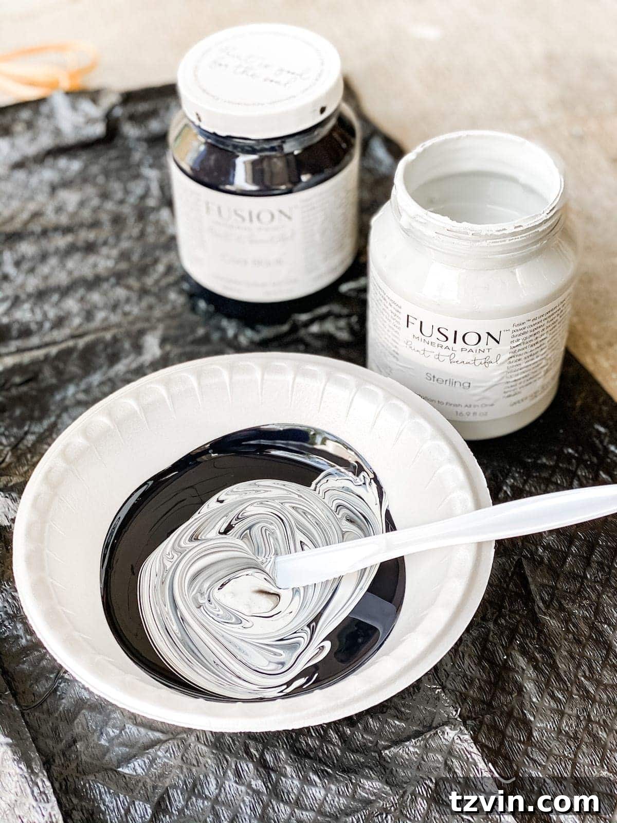 Mixing black and white acrylic Fusion Mineral Paint to create a custom medium gray shade for the lamp base.