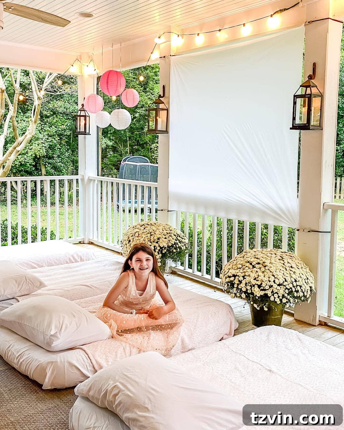 Elevate Small Group Sleepovers With Walmart Plus 2 Kids laughing and having fun at an outdoor sleepover movie night with air mattresses