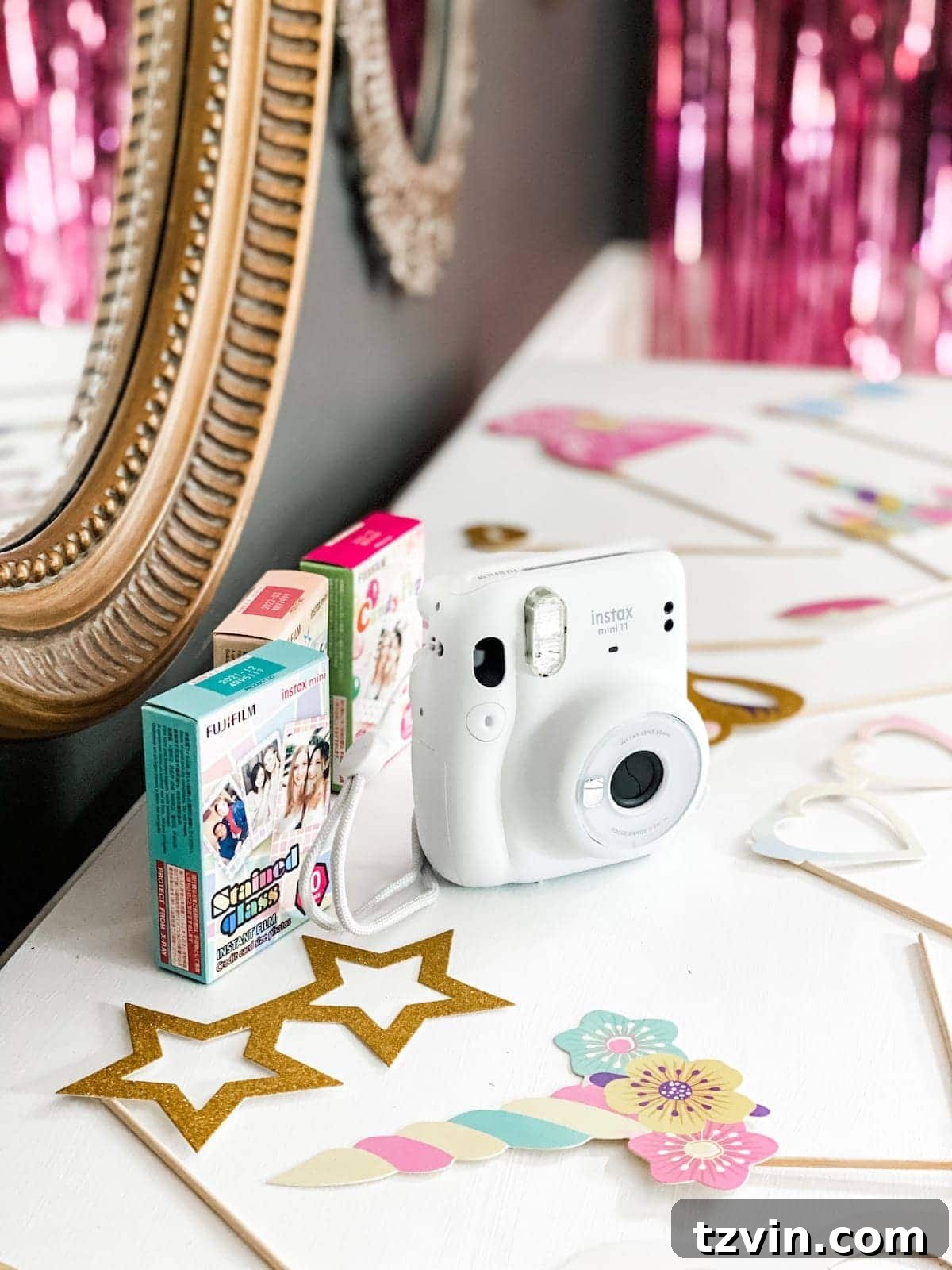 Elevate Small Group Sleepovers With Walmart Plus 7 Close-up of girls taking a picture with an Instax camera at a photo booth