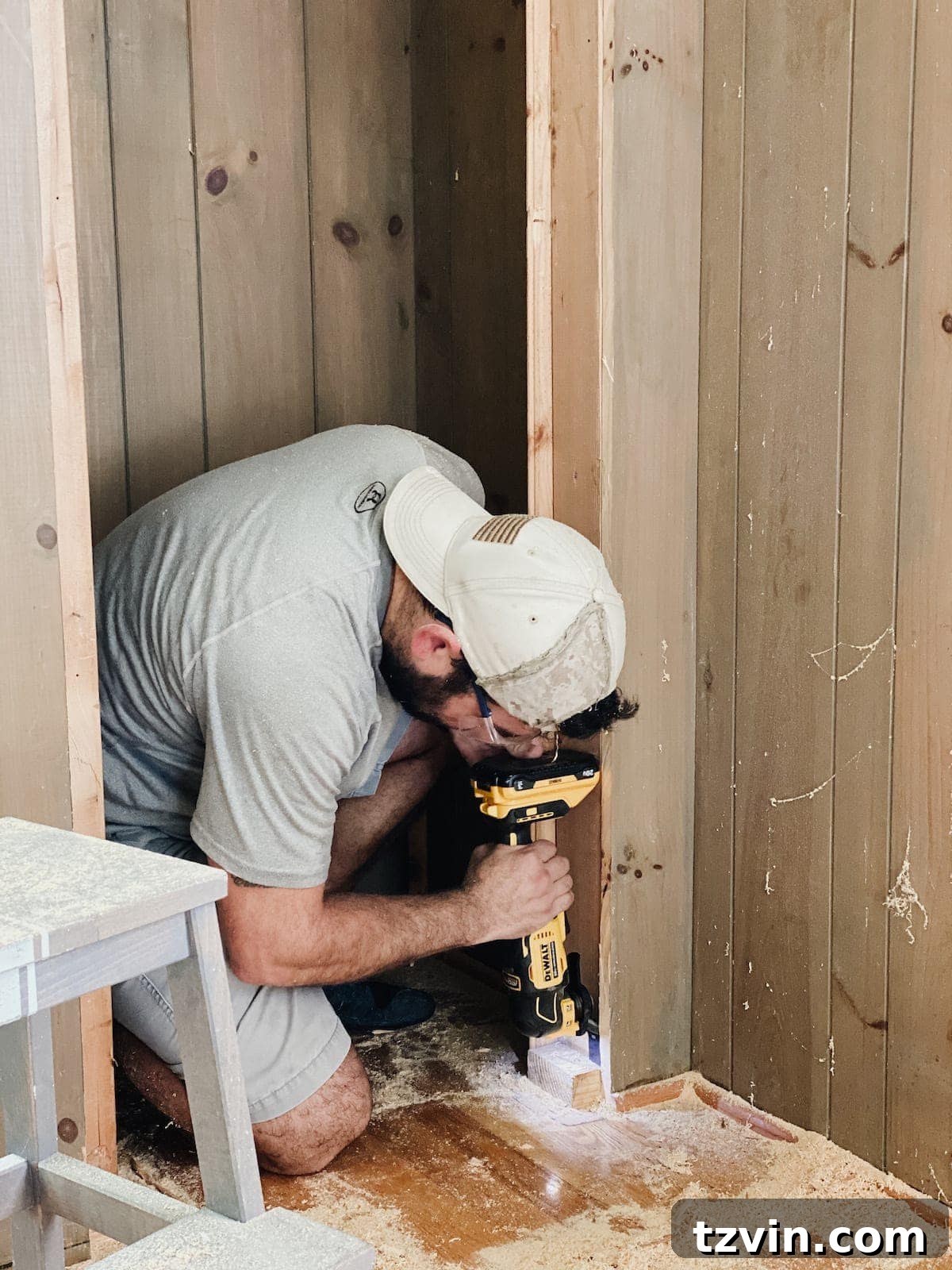Oscillating multi-tool used to clean up edges of a newly cut closet opening