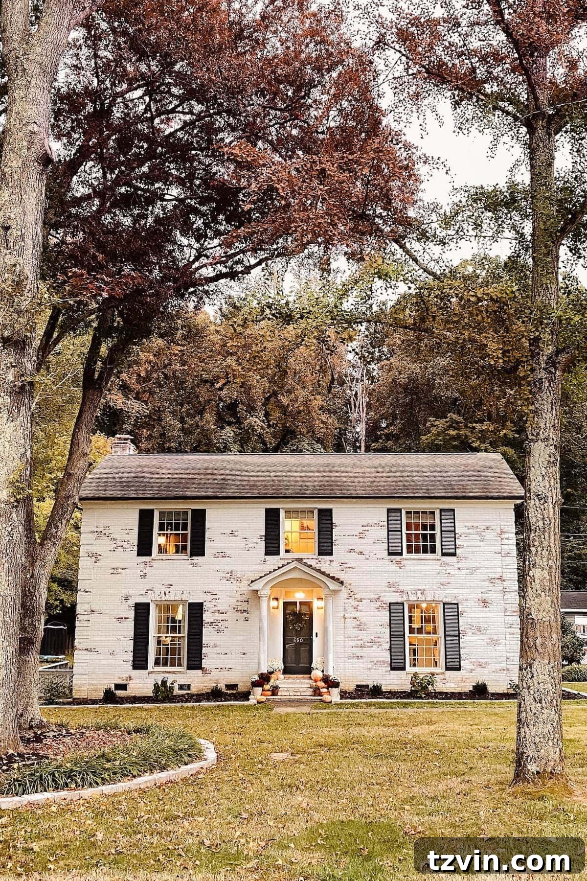 Autumnal Porch Palette 5 limewashed brick colonial house decorated for fall with pumpkins and mums