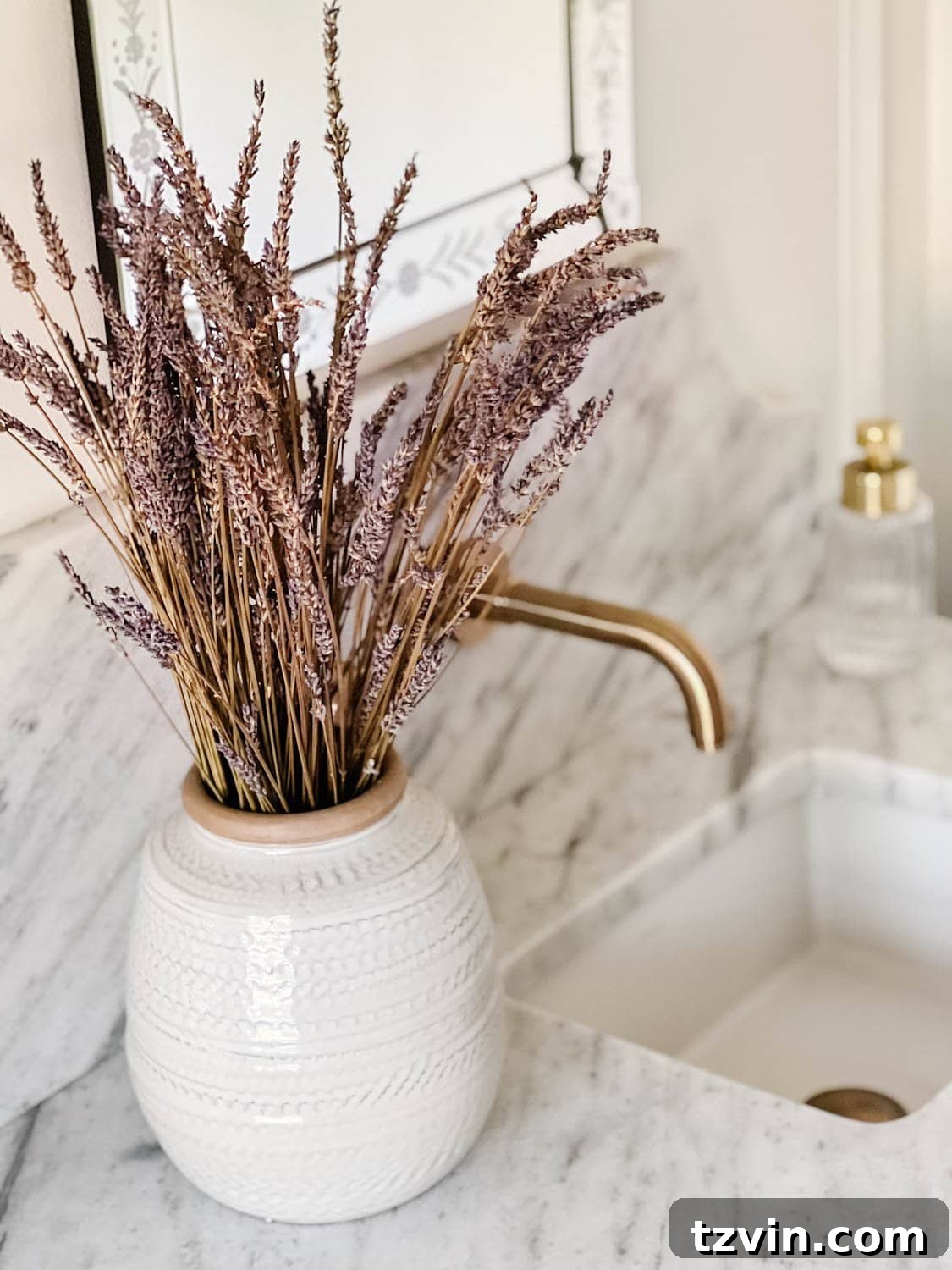 Forever Flowers: Drying and Preserving for Stunning Home Decor 6 dried lavender in a vase on a bathroom countertop, enhancing the spa-like atmosphere