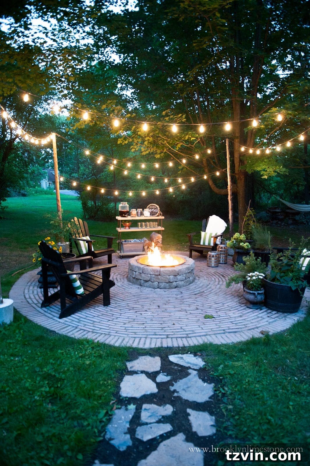 15 Mesmerizing Fire Pit Decor Transformations 16 Fire pit area with string lights, stone walkway, and stylish outdoor decor