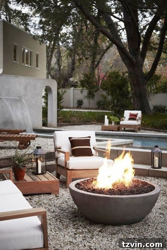 15 Mesmerizing Fire Pit Decor Transformations 9 Elegant poolside fire pit surrounded by pea gravel